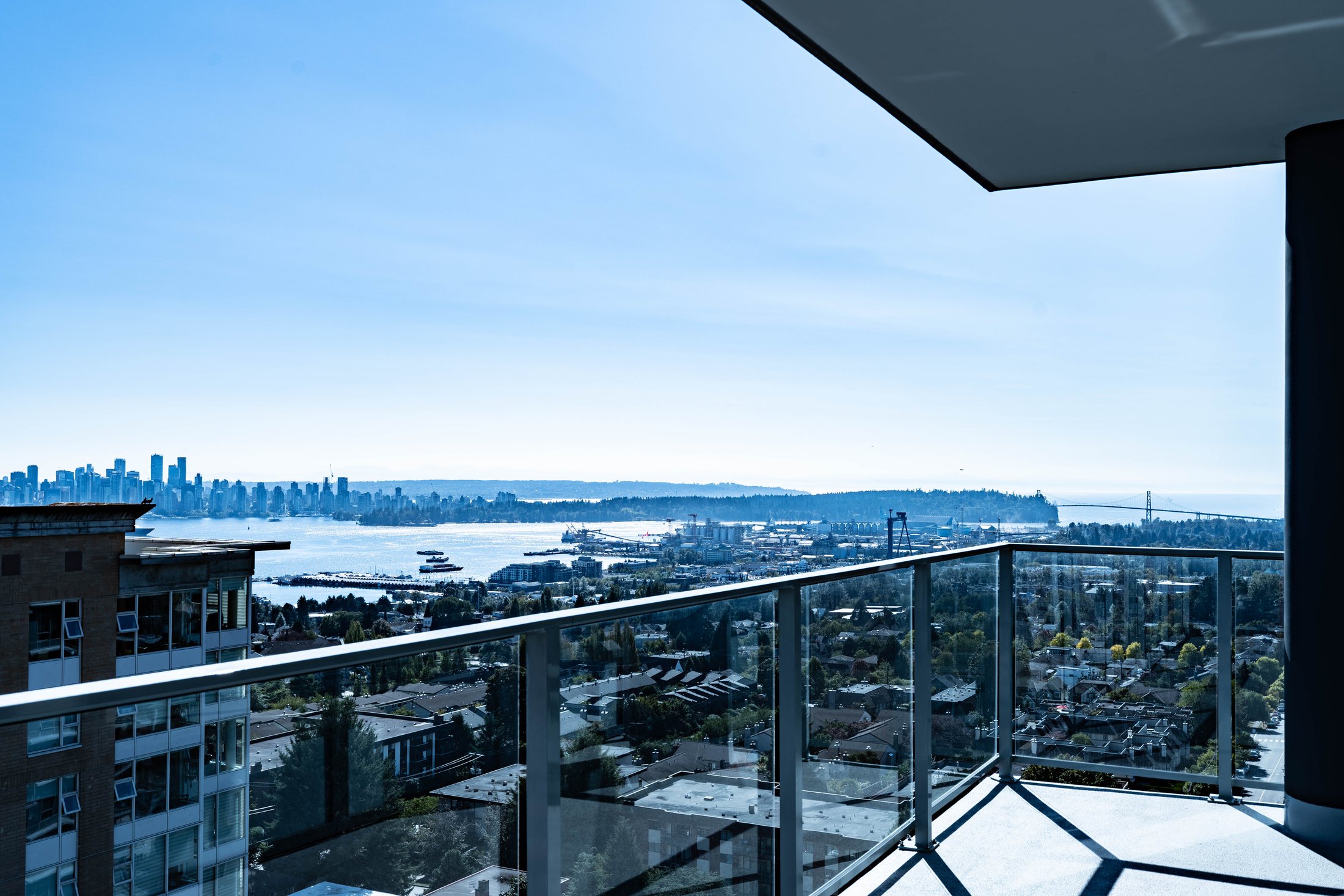 Balcony overlooking the city, water, and North Shore skyline