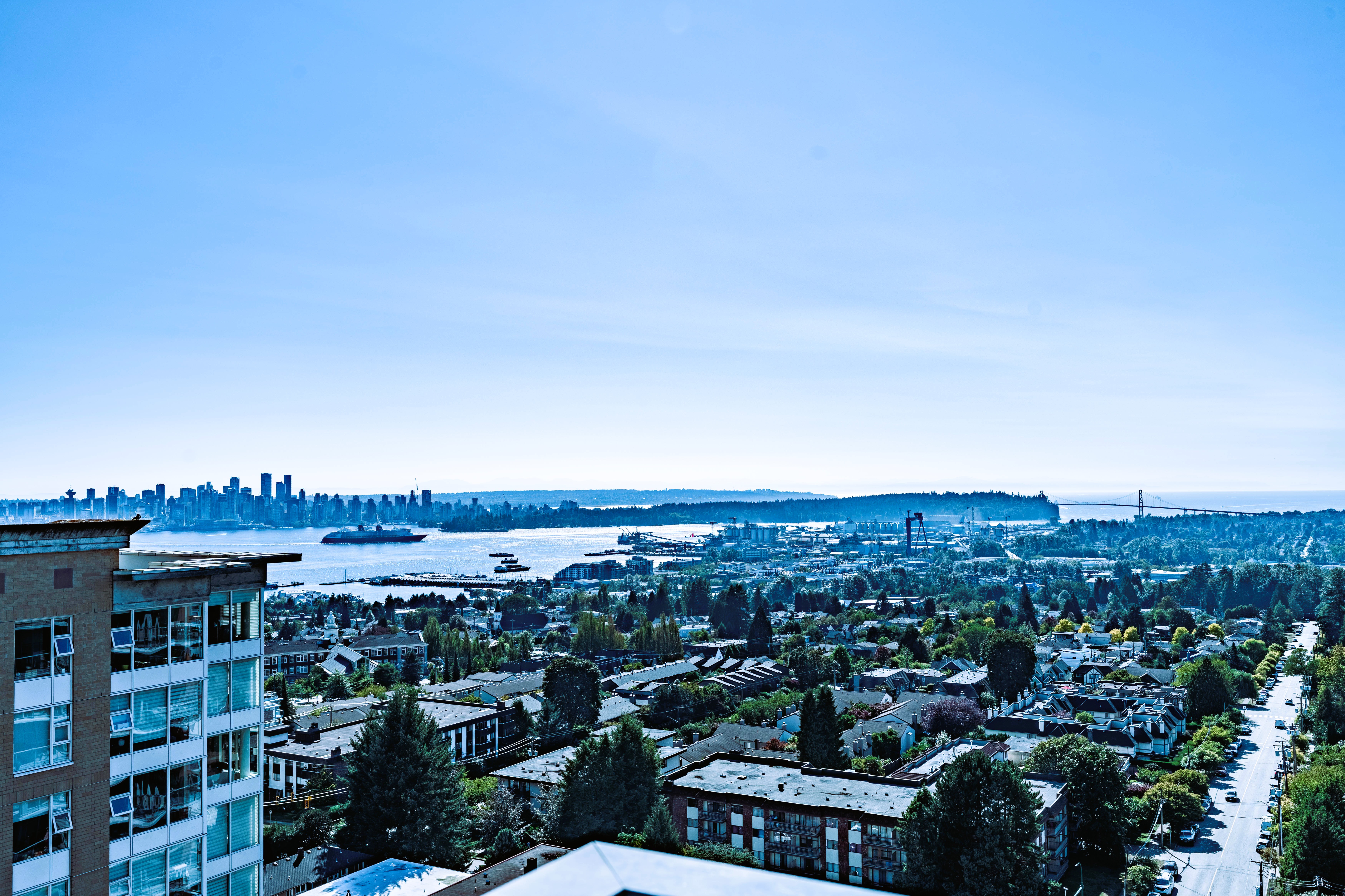 Elevated view across Vancouver, the harbour, and Lions Gate Bridge